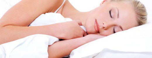 Beautiful pretty sleeping woman cover the white blanket
